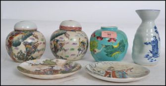 A group of Oriental ceramics to include lidded ginger jars depicting typical scenes, a blue and