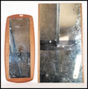 A retro 20th century atomic teak framless mirror together with another larger teak mirror of