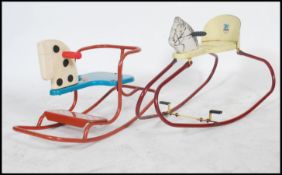 Two retro vintage 20th century child's rocking horses one being a Triang Gee Gee rocker, the other