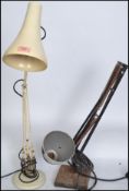 A retro mid century Herbert Terry anglepoise lamp on a circular base with conical shade together