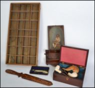 A collection of wooden treen items to include a vintage printers tray, cased meerschaum pipe, inlaid