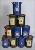 A collection of ten commemorative Bells Whisky decanters, with contents in original packaging.