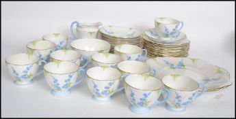A 20th century Bone China tea service by Standard China in the forget me not pattern consisting of