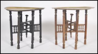 A pair of early 20th century Binares wooden and brass opium merchants tables. Each with decorative