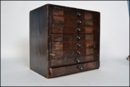 A mid century Industrial wooden printers table top cabinet - chest. Each drawer with printing blocks