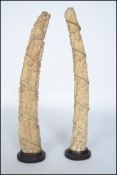 A stunning pair of 19th century Loango - Congolese carved ivory tusks with seven tiers of figures
