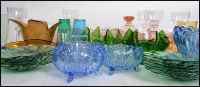 A large collection of studio art glass to include a peach glass dessert set, a set of six wine