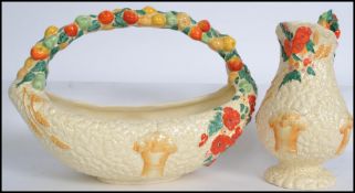 A Clarice Cluff for Newport Pottery basket, ' Celtic Harvest ' design boat shaped with fruit moulded