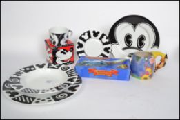 A collection of Disney related ceramic collectors items to include black and white Mickey Mouse
