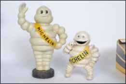 A vintage style cast iron advertising point of sale money bank in the form of Bibendum The