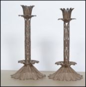 A pair of stunning Anglo Indian filigree 19th century silver candlesticks, raised on a 15 segment