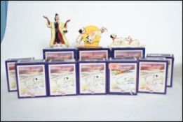 A collection of boxed Royal Doulton ceramic figurines from Disney's 101 Dalmatians collection to