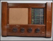 A vintage mid 20th century Defiant AC receiver model MSH547 wood cased valve radio complete with