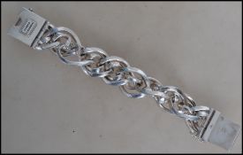 A designer Buddha to Buddha 925 silver bracelet with large oval links and a box clasp. Marked Buddha