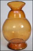 A large 20th century retro studio art glass orange baluster vase of tapering form having a bulbous