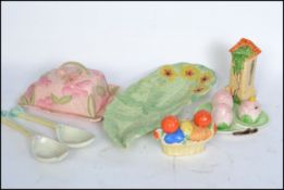 A collection of early 20th century Art Deco ceramics to include butter dish, cruet sets, salad