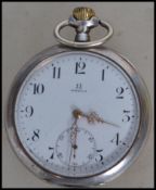 A vintage 20th century Omega gentleman's silver cased pocket watch having winder to top with