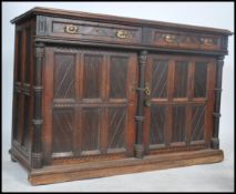 A 19th century Victorian Arts and Crafts ecclesiastical  oak and ebony inlaid sideboard dresser