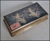 A 20th century vintage Siam sterling silver table top cigarette case with scenes of deity's to the