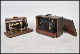 A good Victorian Jones sewing machine complete in the wooden carry case together with a later