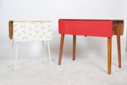 A vintage retro 1970's red formica dining table with drop leaves together with another having
