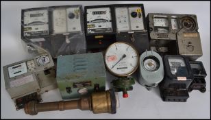 A large collection of vintage 20th century industrial / steampunk electric meters, gauges, dials,