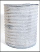 A mid century Industrial corrugated metal  bird grain bin holder of large form, conical shape with