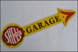 A vintage style painted cast iron advertising point of sale garage sign for Shell in the form of