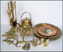 A good collection of 20th century copper and brass wares to include drinks measures in the form of