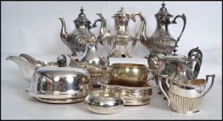 A collection of silver plated wares to include large teapot and coffee pot with matching sugar