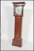 A 19th century long case grandfather clock having an oak trunk having a columned hood with gilded
