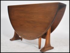 A vintage 20th century retro ' Golden Dawn ' Ercol elm wood drop leaf side / coffee table. The table