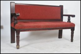 A mid century solid wood municipal railway / train station waiting room interior bench seat with