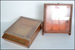 Two vintage / retro 20th century point of sale shop advertising display cases for Henry Winterman