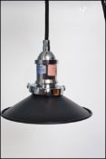 A pair of vintage retro industrial style Spangle pendant ceiling lights having a black finish to the