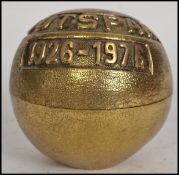 An unusual gilt brass Outspan 1926 - 1976 caddy in the form of an orange with notation atop,