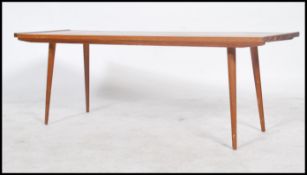 A 1960's retro Danish influenced teak wood rectangular coffee occasional table, Raised on tapered