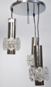 A retro 20th century chrome three point ceiling light fixture having a large circular chrome ceiling