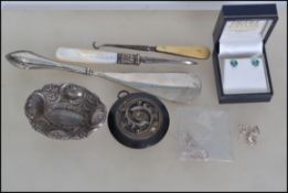 A mixed lot of hallmarked silver and other items to include a Victorian mother of pearl handled