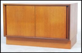 A vintage retro G Plan low teak fresco sideboard record media player unit. Having twin sliding doors