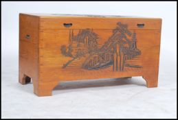 A mid century camphor wood Chinese trunk / blanket box having panel sides with hinged top, all
