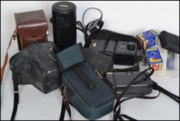 A collection of vintage cameras Halina Viceroy dual lens camera, Olympus Trip 35, Olymyus OM 20 35