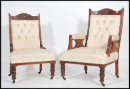 A pair of late Victorian ladies and gentleman's salon armchairs. Each raised on turned legs with