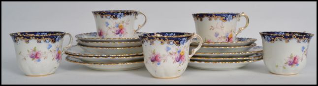 A good group of five early 20th century Royal Albert Crown china trios in an Imari / chintzy pattern