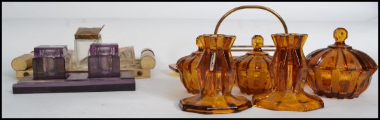 A group of art deco items to include an art deco inkwell and desk stand, a purple glass art deco