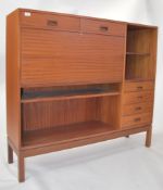 A 1970's teak wood Danish influence highboard side