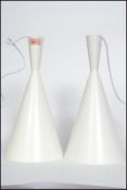 A pair of vintage retro style waisted pendant conical pendant ceiling lights after a Tom Dixon