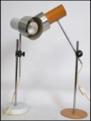2 1970's /1980's Italian anglepoise desk lamps in polished steel and yellow colourway to one,