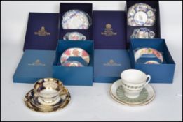 A collection of boxed Royal Worcester ceramic cup saucer and side plate trios to include