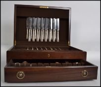 A good canteen of cutlery being complete within a quality hinged mahogany canteen. The service being